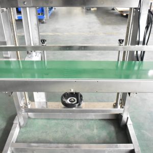 AS600F band sealer: de transporttafel en het handwiel voor de hoogte-instelling